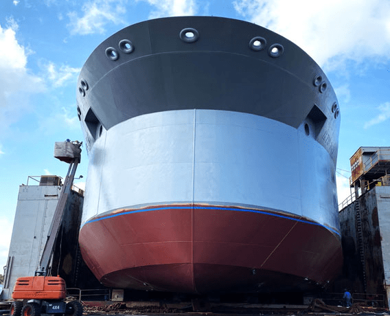 Ship Maintenance & Dry Docking Egypt image showing a ship docked at the port and Dry Docking services by white pigeon marine services being performed on it