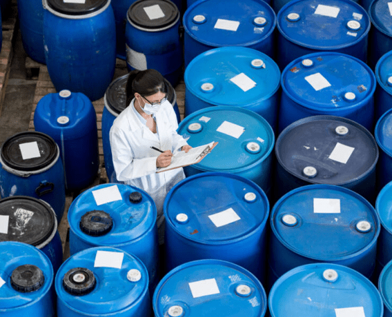 image shown a quality testing agent checking water tanks after adding chemicals designed to maintain the quality and safety of your water systems by white pigeon marine services